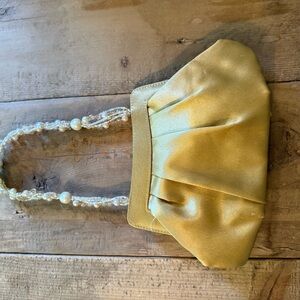 Elegant Gold Satin Clutch with Pearl Handle